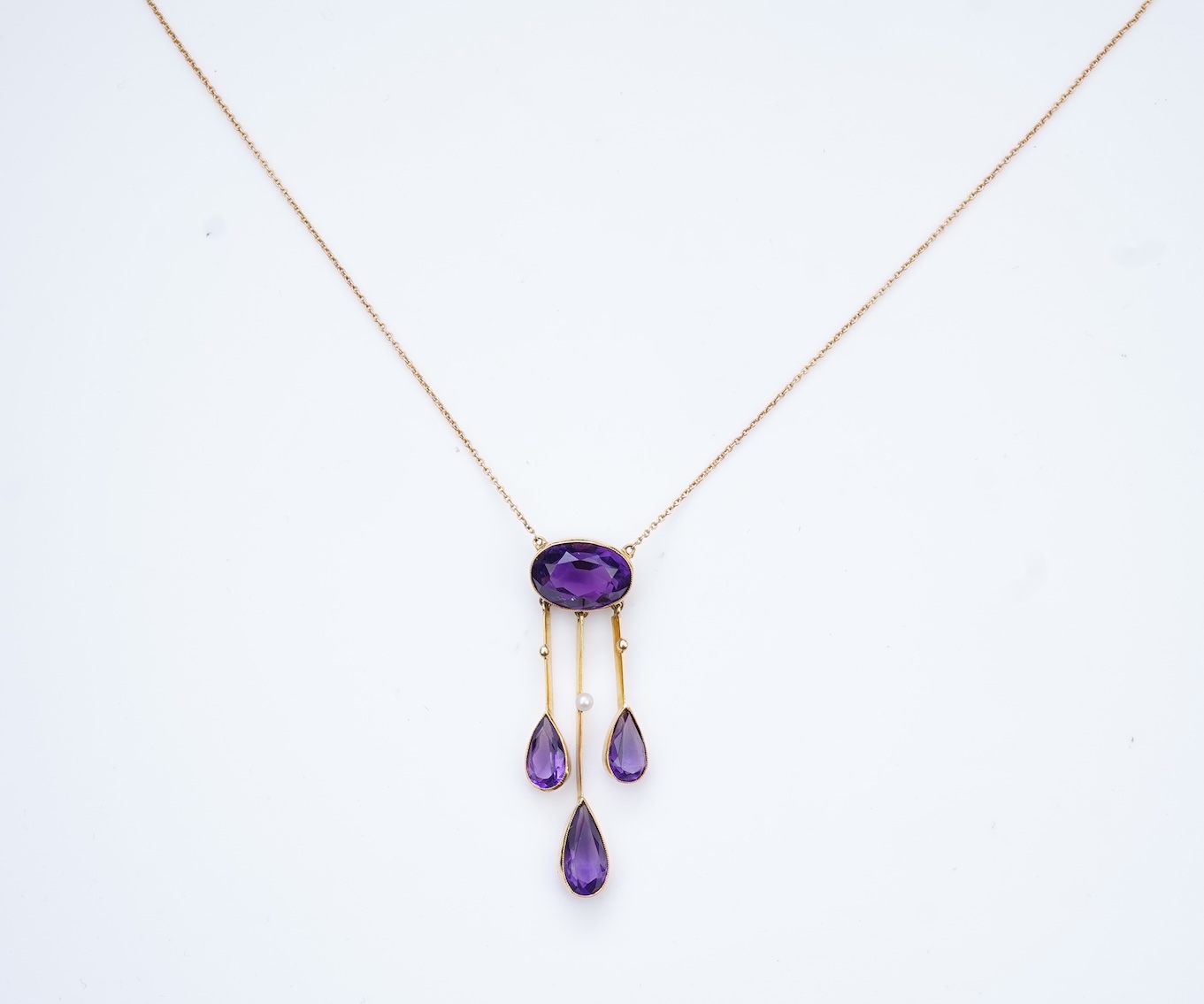 An Edwardian amethyst and seed pearl pendant, circa 1910